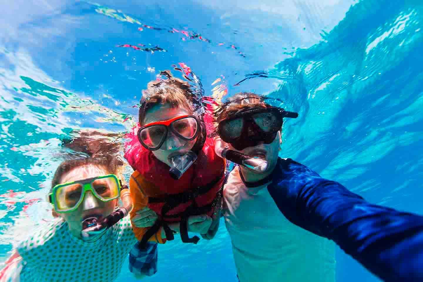 Family snorkeling underwater