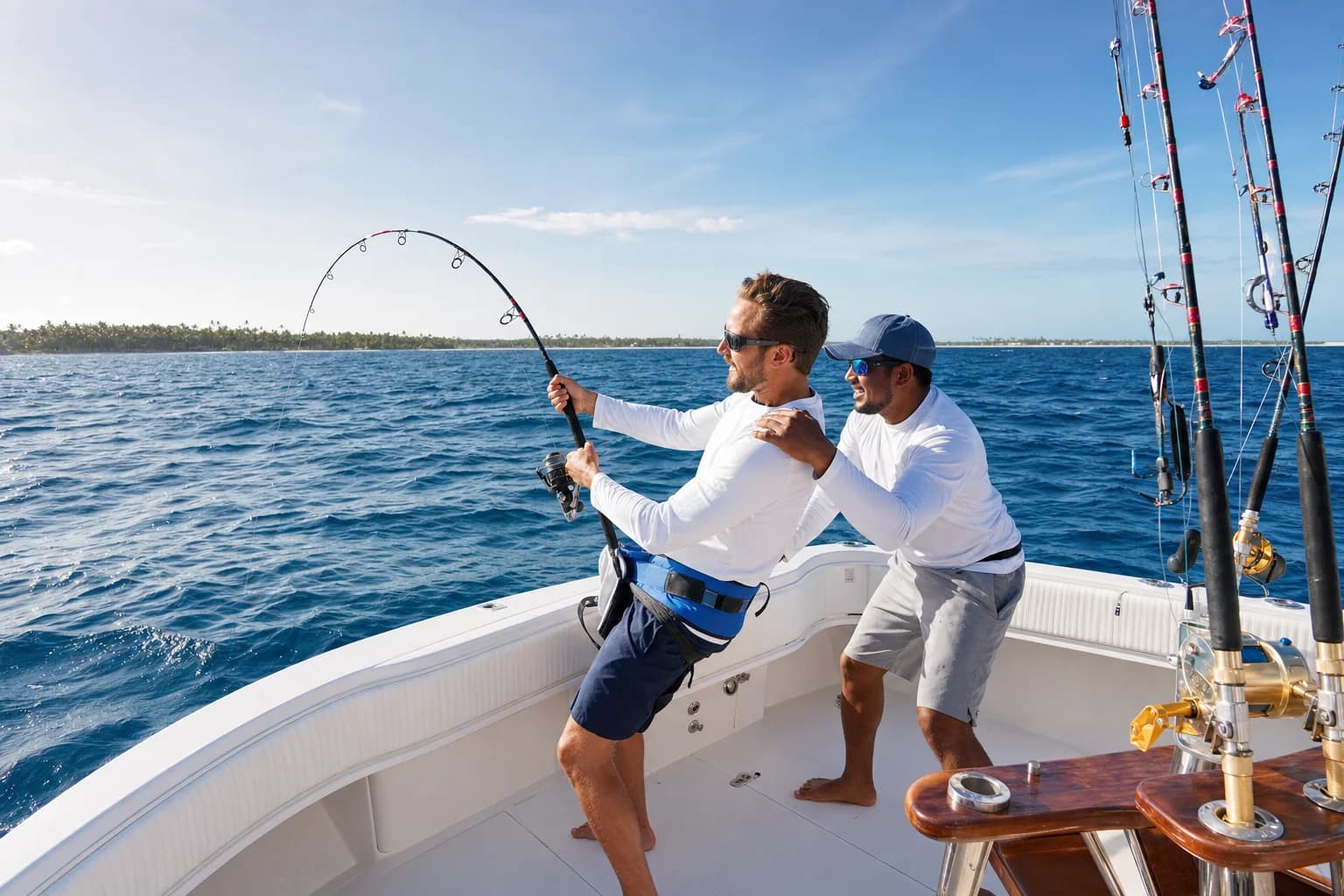 Traveler and professional guide fishing from a sportfishing boat off Punta Cana